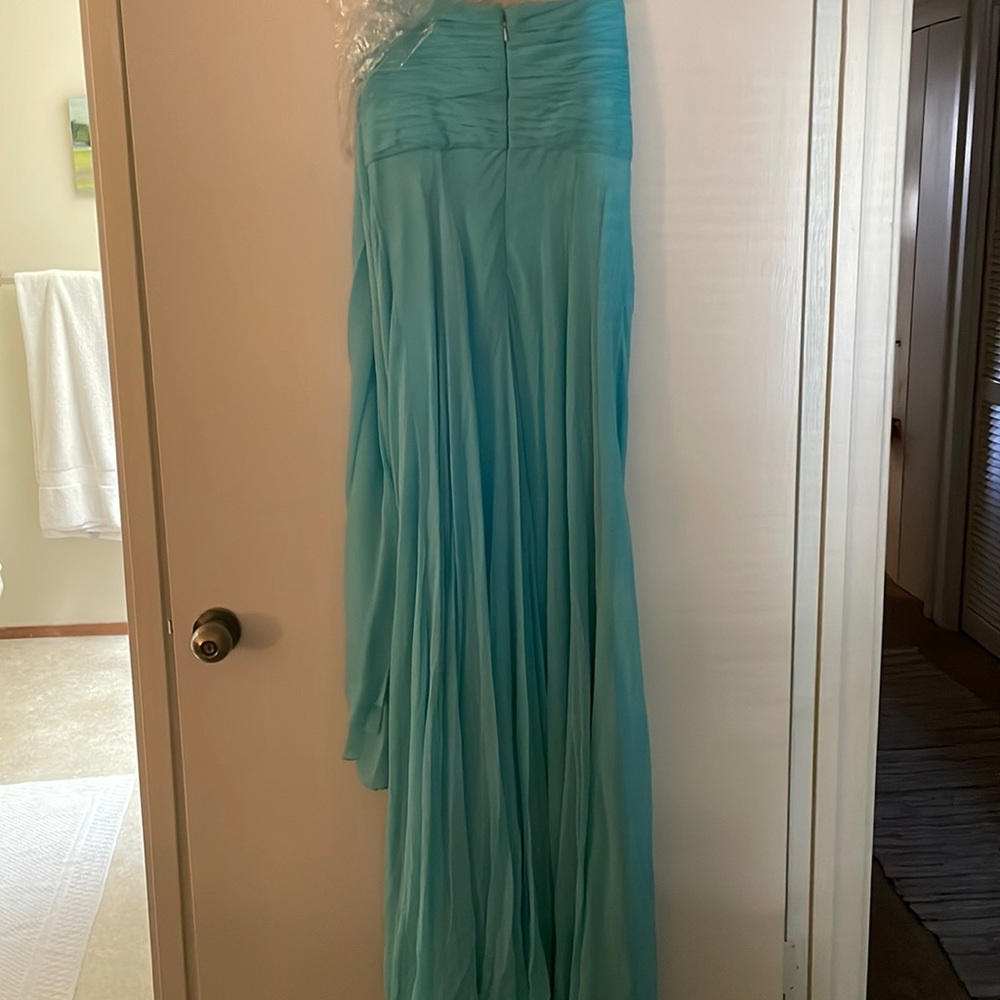 Beautiful turquoise evening gown with detachable self fabric scarf.